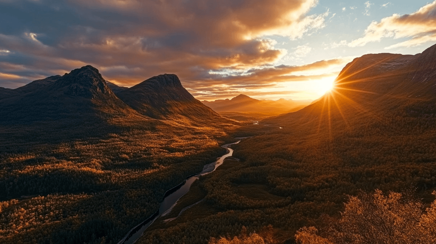 A breathtaking mountain range with jagged peaks towering over a vast expanse of wilderness. The golden hues of the setting sun cast long shadows across the rocky terrain, while a winding river snakes through the valley below. The sky is painted with deep oranges and purples, enhancing the dramatic beauty of the remote landscape.